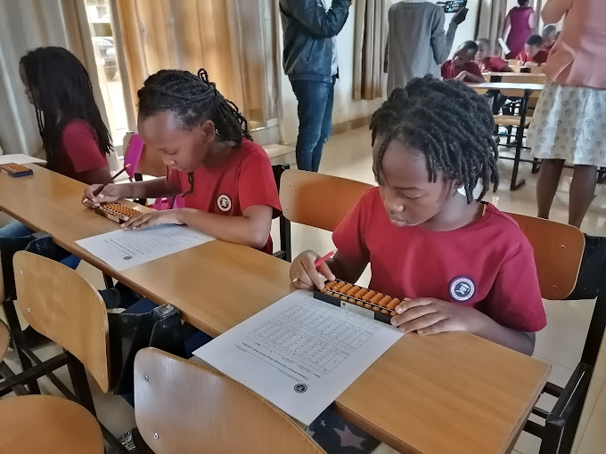 Shenmo Education Rwanda — Competition formats: students at the 2019 Shenmo Rwanda Abacus Mental Math competition.